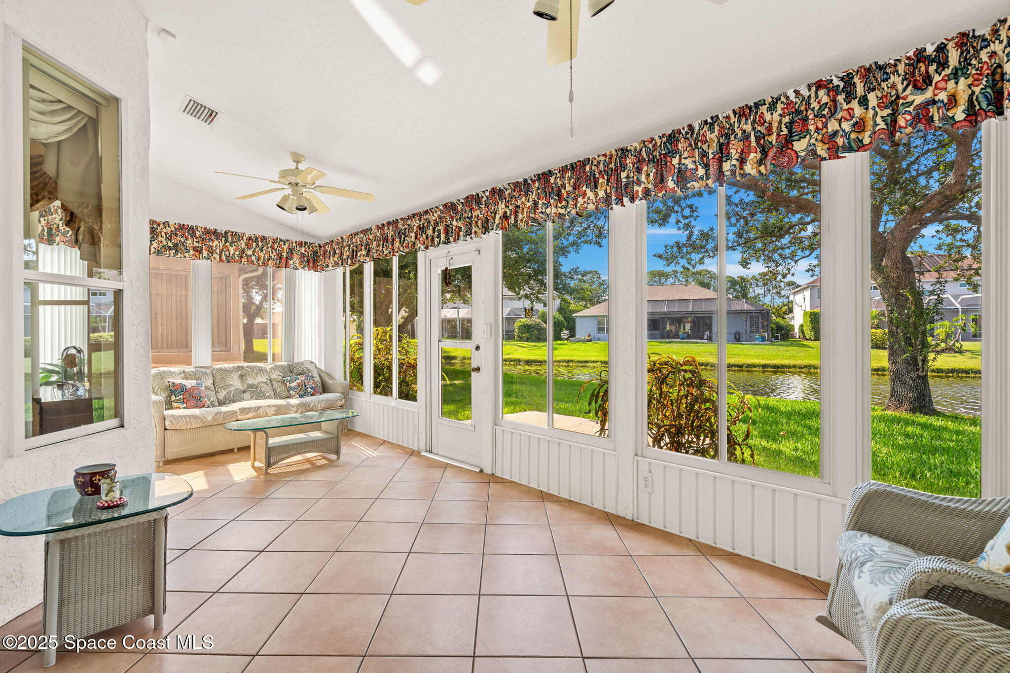 7702 Candlewick Drive Melbourne, FL 32940 - Photo 14 of 37 a living room with furniture and a large window