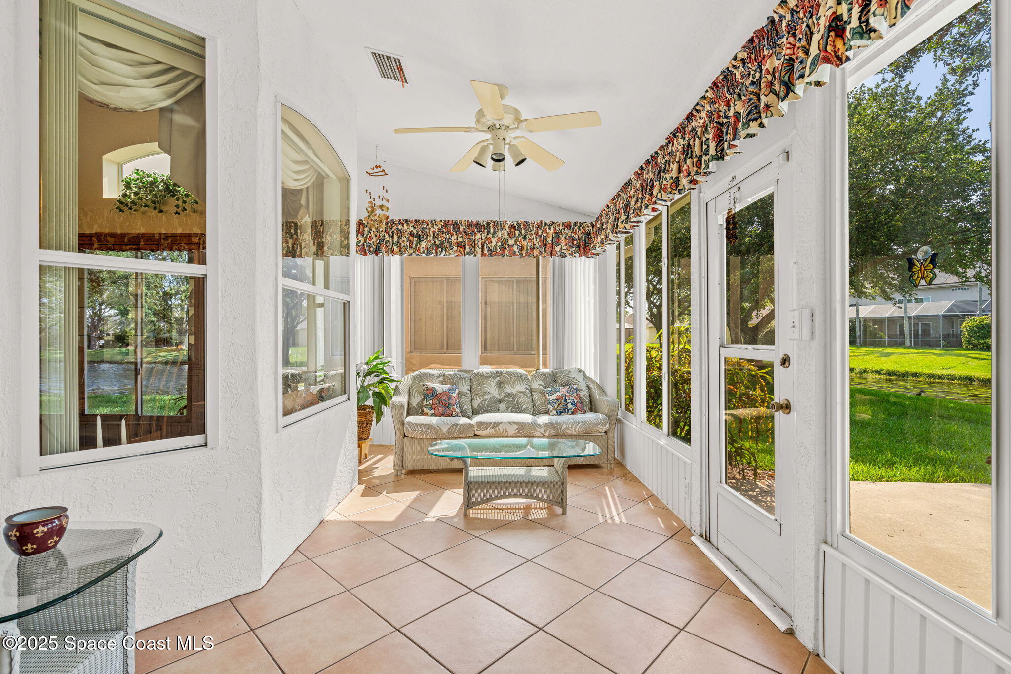 7702 Candlewick Drive Melbourne, FL 32940 - Photo 15 of 37 a living room with furniture and a large window
