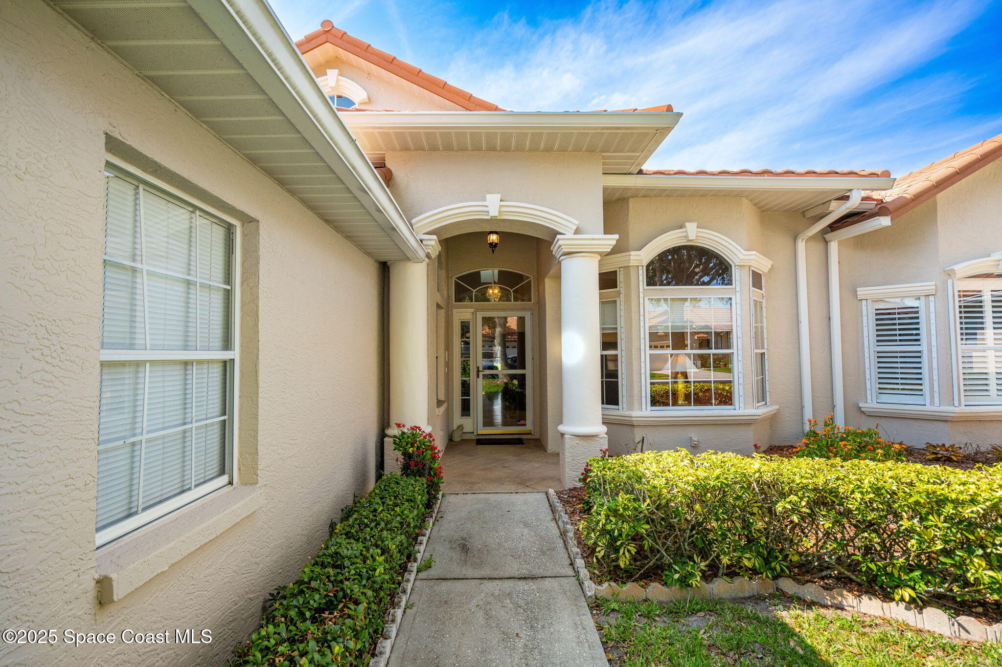 7702 Candlewick Drive Melbourne, FL 32940 - Photo 2 of 37 a view of entrance door of the house
