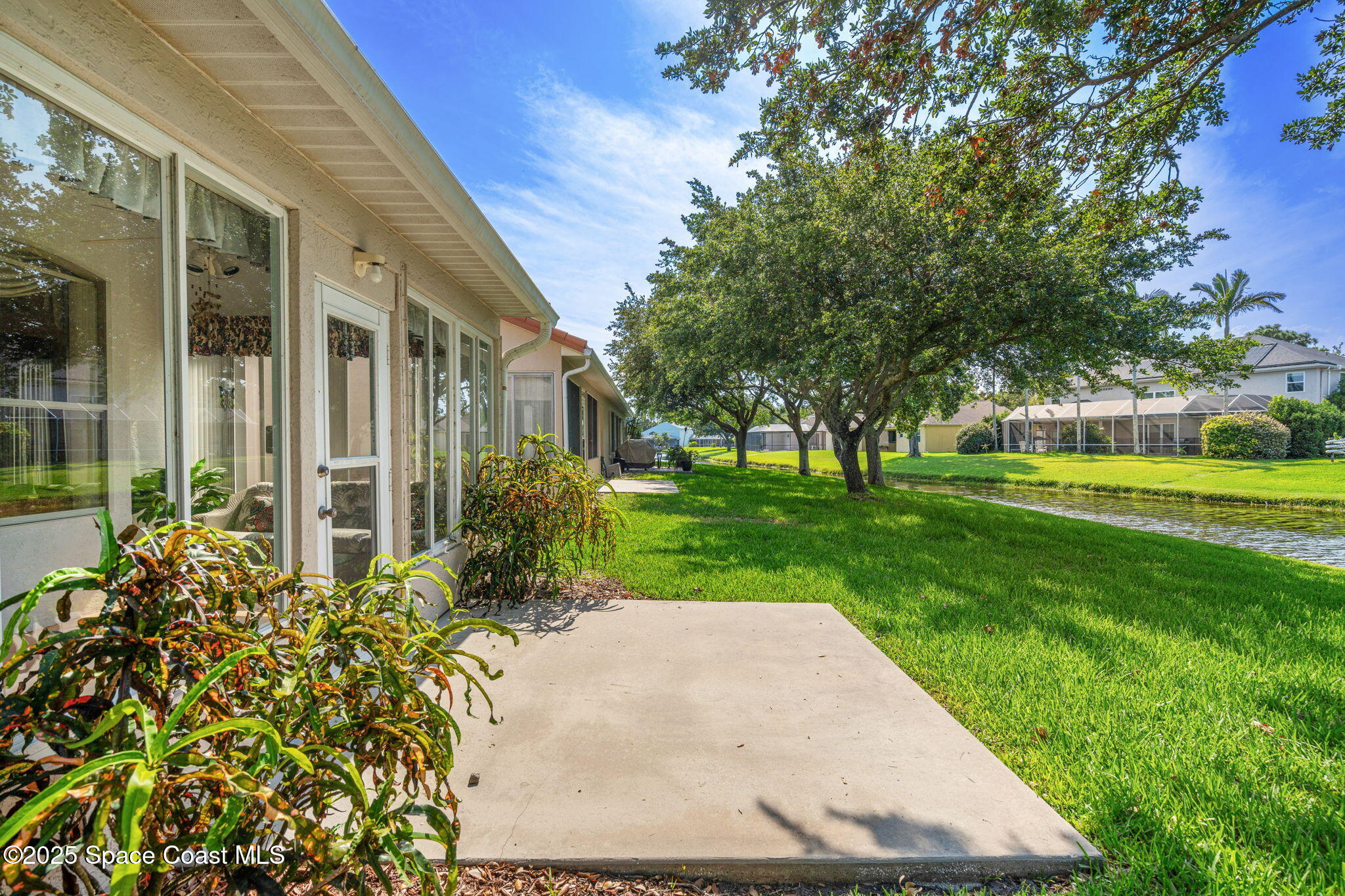 7702 Candlewick Drive Melbourne, FL 32940 - Photo 27 of 37 a view of a garden with pathway