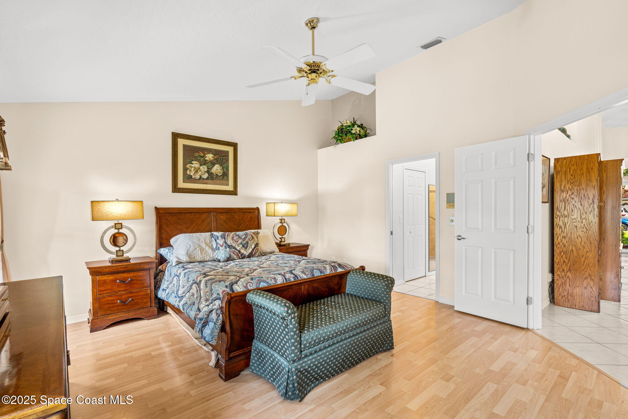 7702 Candlewick Drive Melbourne, FL 32940 - Photo 3 of 37 a bedroom with a bed dresser and a window