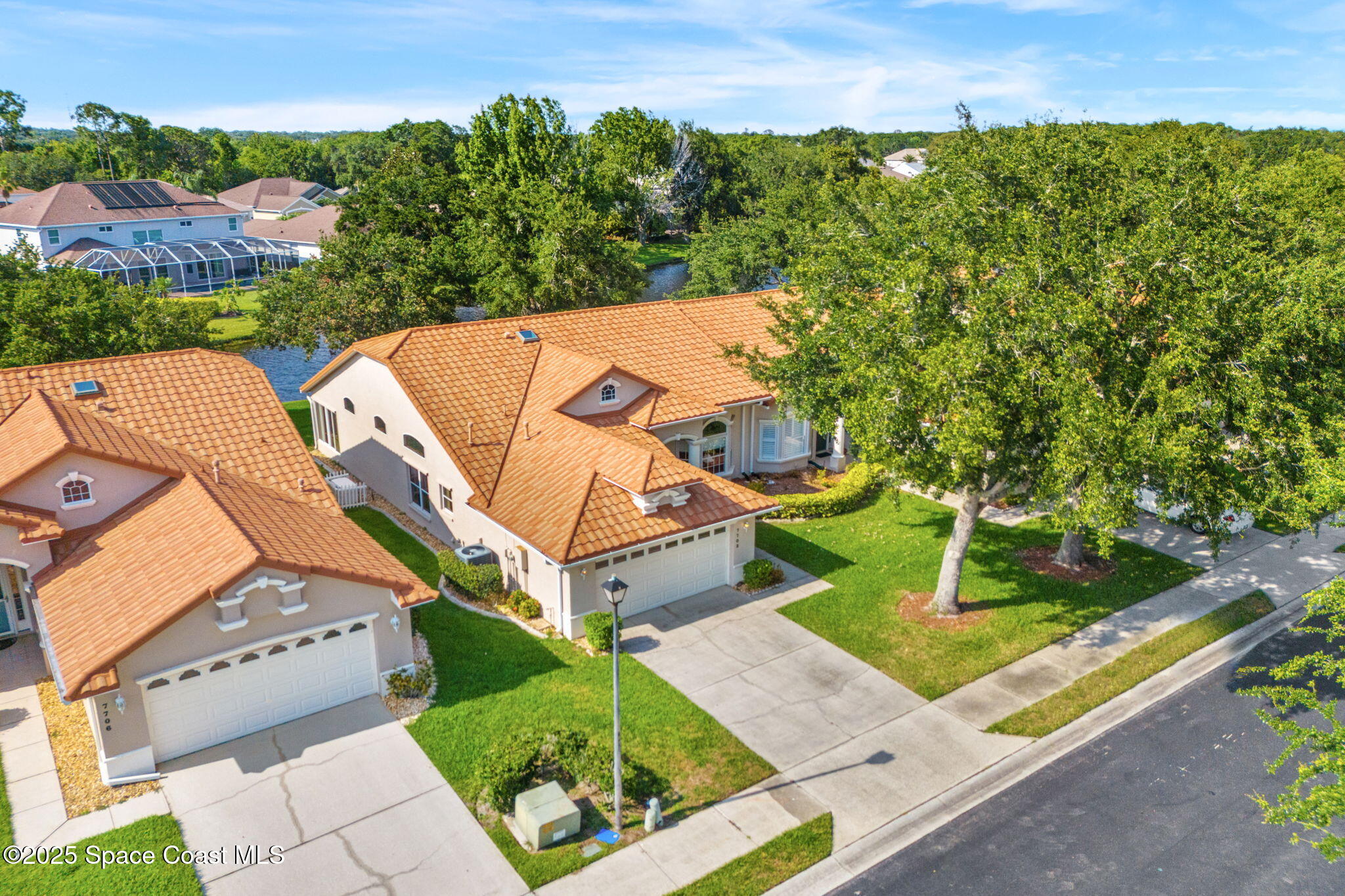 7702 Candlewick Drive Melbourne, FL 32940 - Photo 31 of 37 an aerial view of a house with a yard