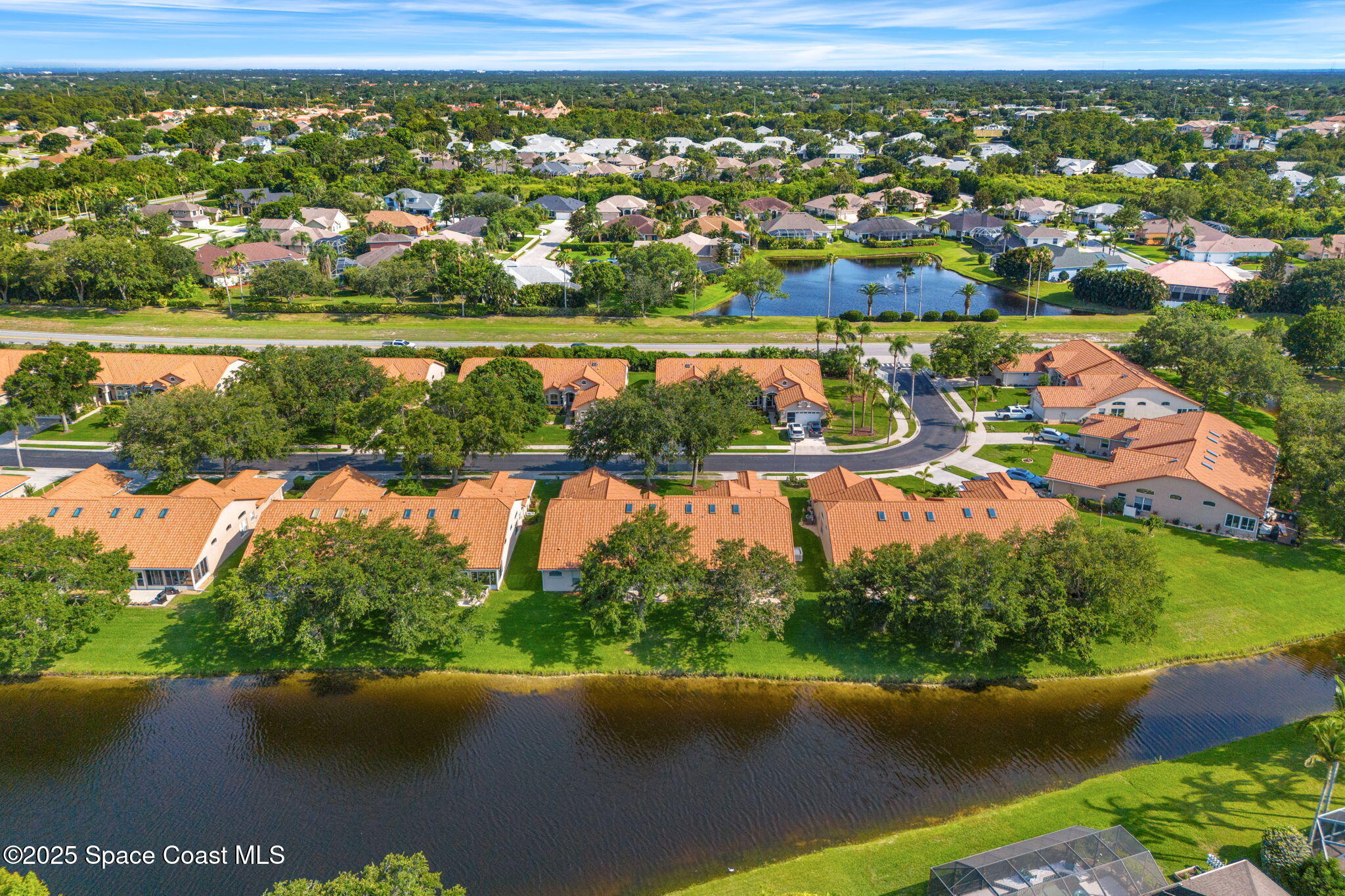 7702 Candlewick Drive Melbourne, FL 32940 - Photo 35 of 37 an aerial view of residential houses with outdoor space