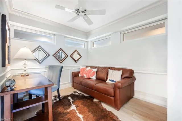 a living room with furniture and a lamp
