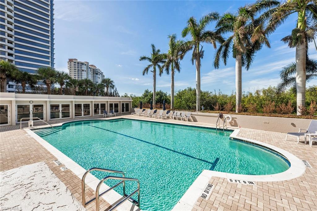 6849 Grenadier Boulevard, Unit 503 Naples, FL 34108 - Photo 35 of 50 a view of a house with a swimming pool and a patio