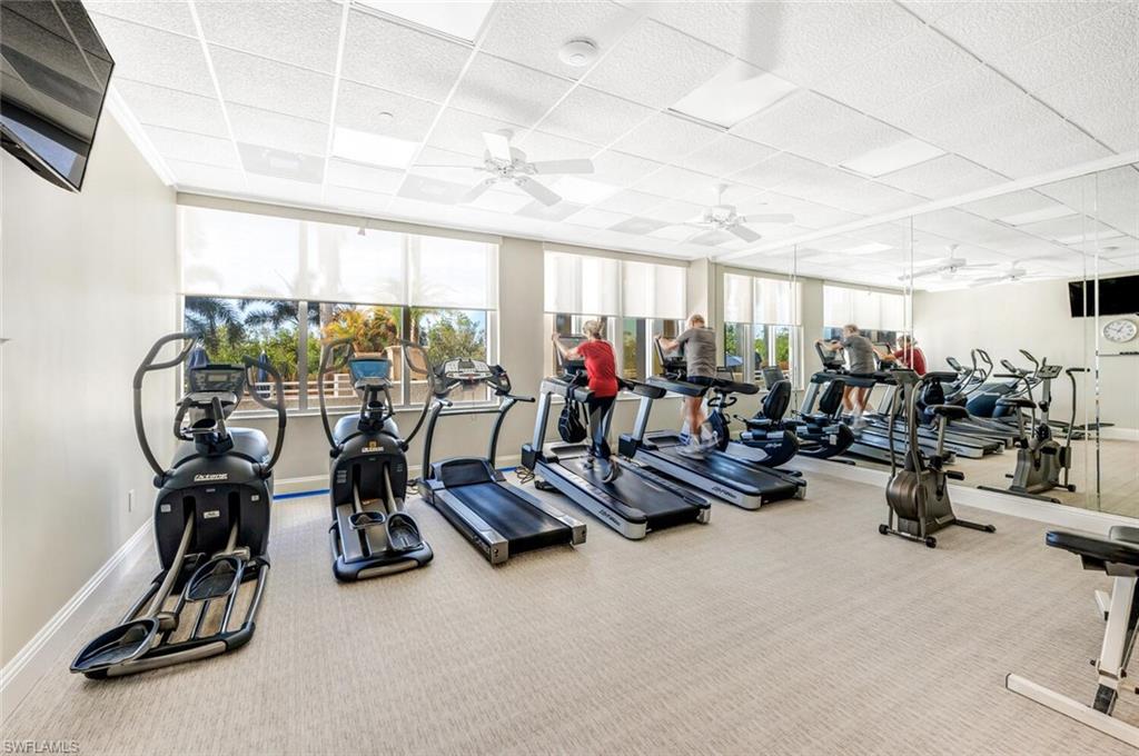 6849 Grenadier Boulevard, Unit 503 Naples, FL 34108 - Photo 36 of 50 a view of a room with gym equipment