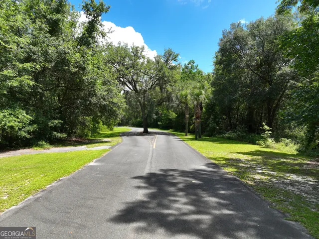 a view of swimming pool with a yard