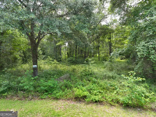 a view of swimming pool with a yard