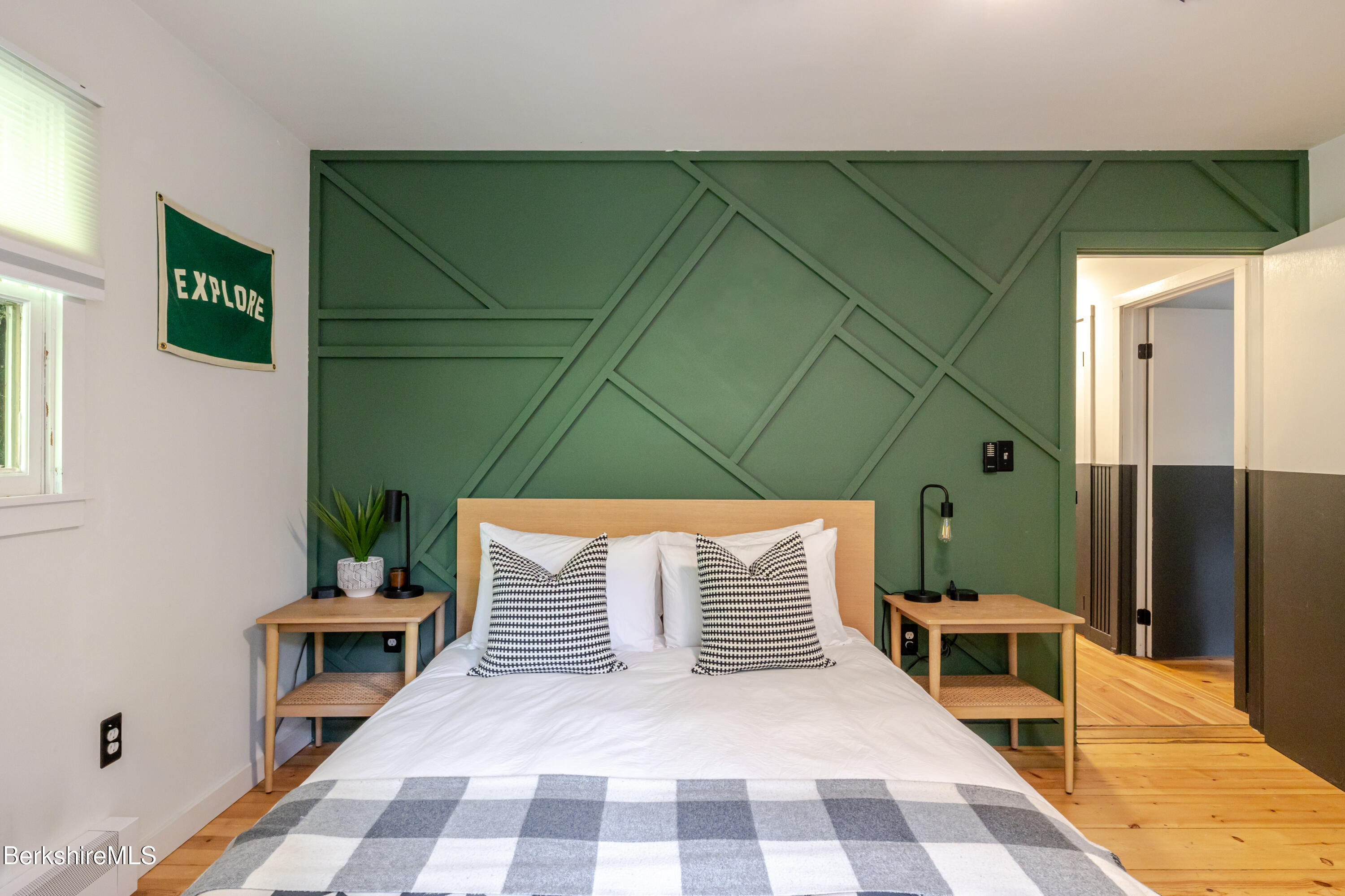 176 Division Street Great Barrington, MA 01230 - Photo 20 of 40 a bedroom with a bed and wooden floor