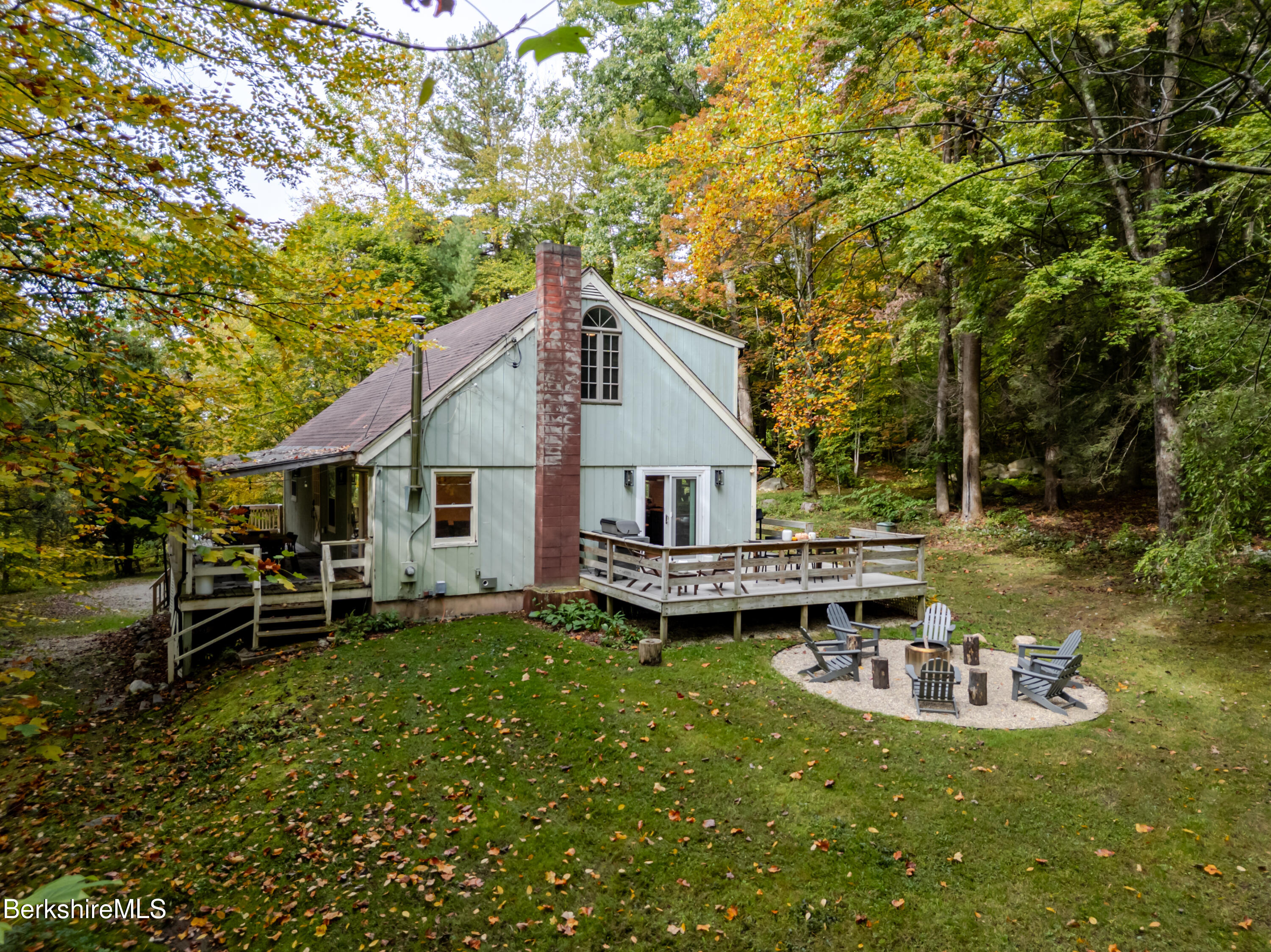 176 Division Street Great Barrington, MA 01230 - Photo 2 of 40 a view of a house with backyard and sitting area
