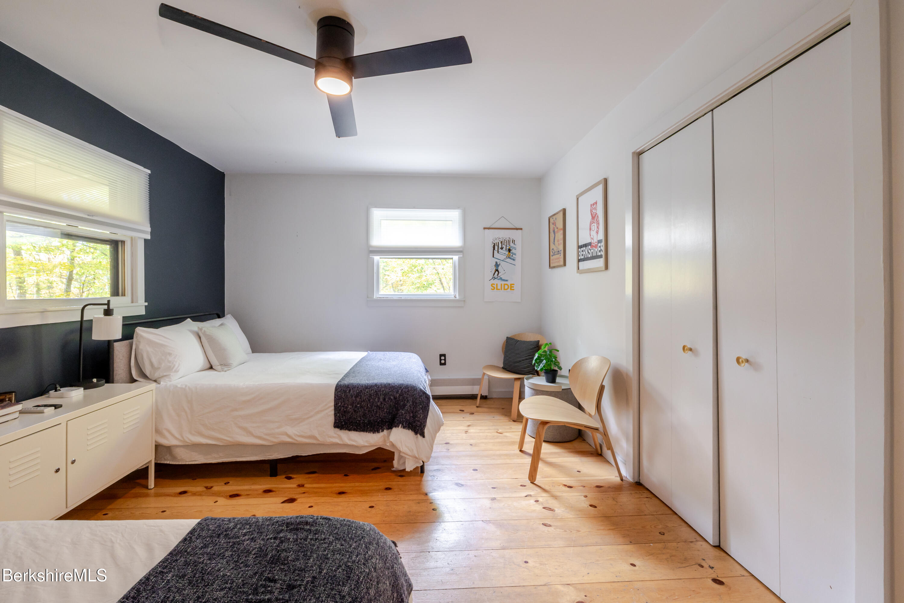 176 Division Street Great Barrington, MA 01230 - Photo 22 of 40 a bedroom with a bed a couch and a window