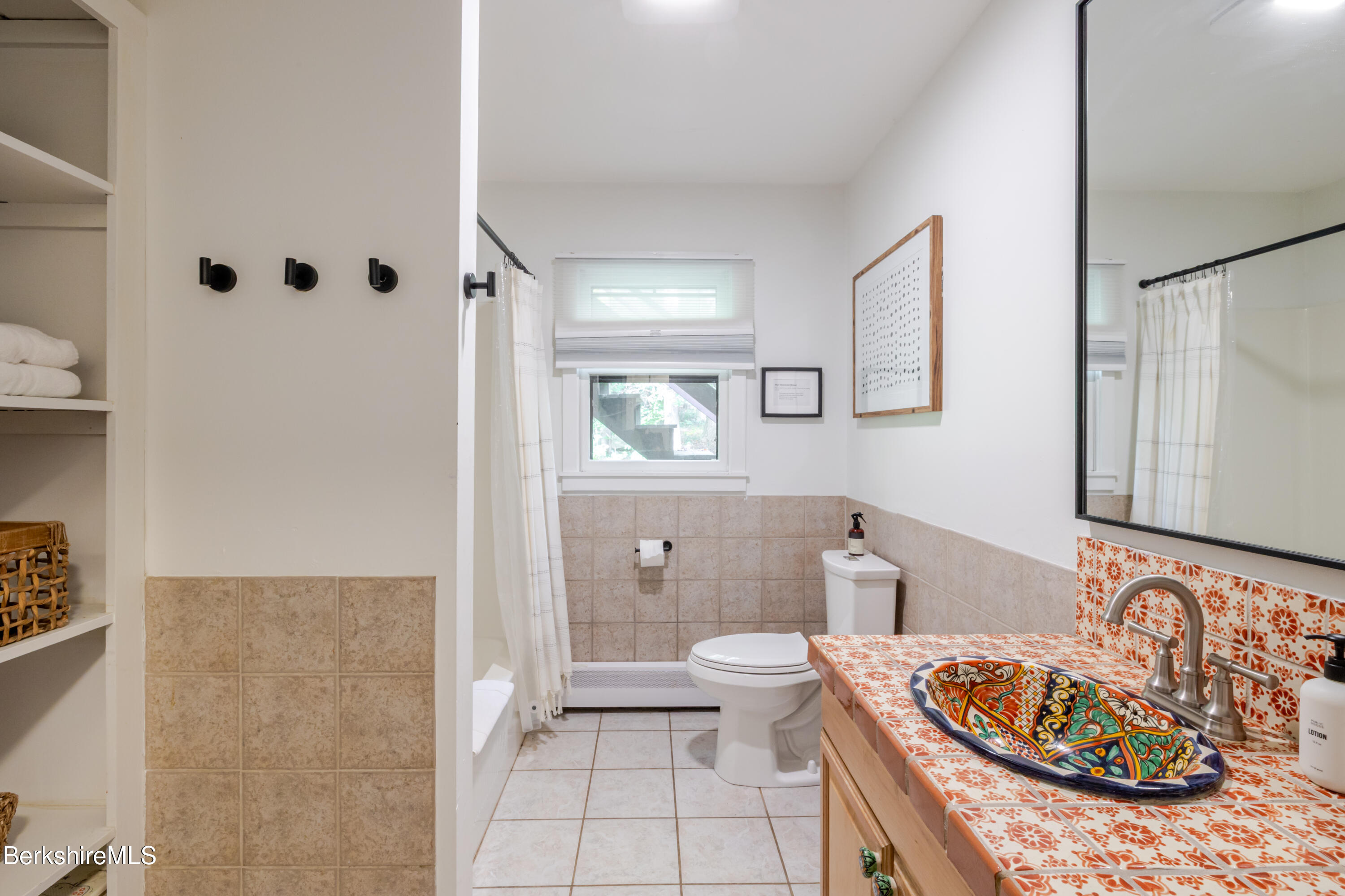 176 Division Street Great Barrington, MA 01230 - Photo 23 of 40 a bathroom with a sink a toilet and shower