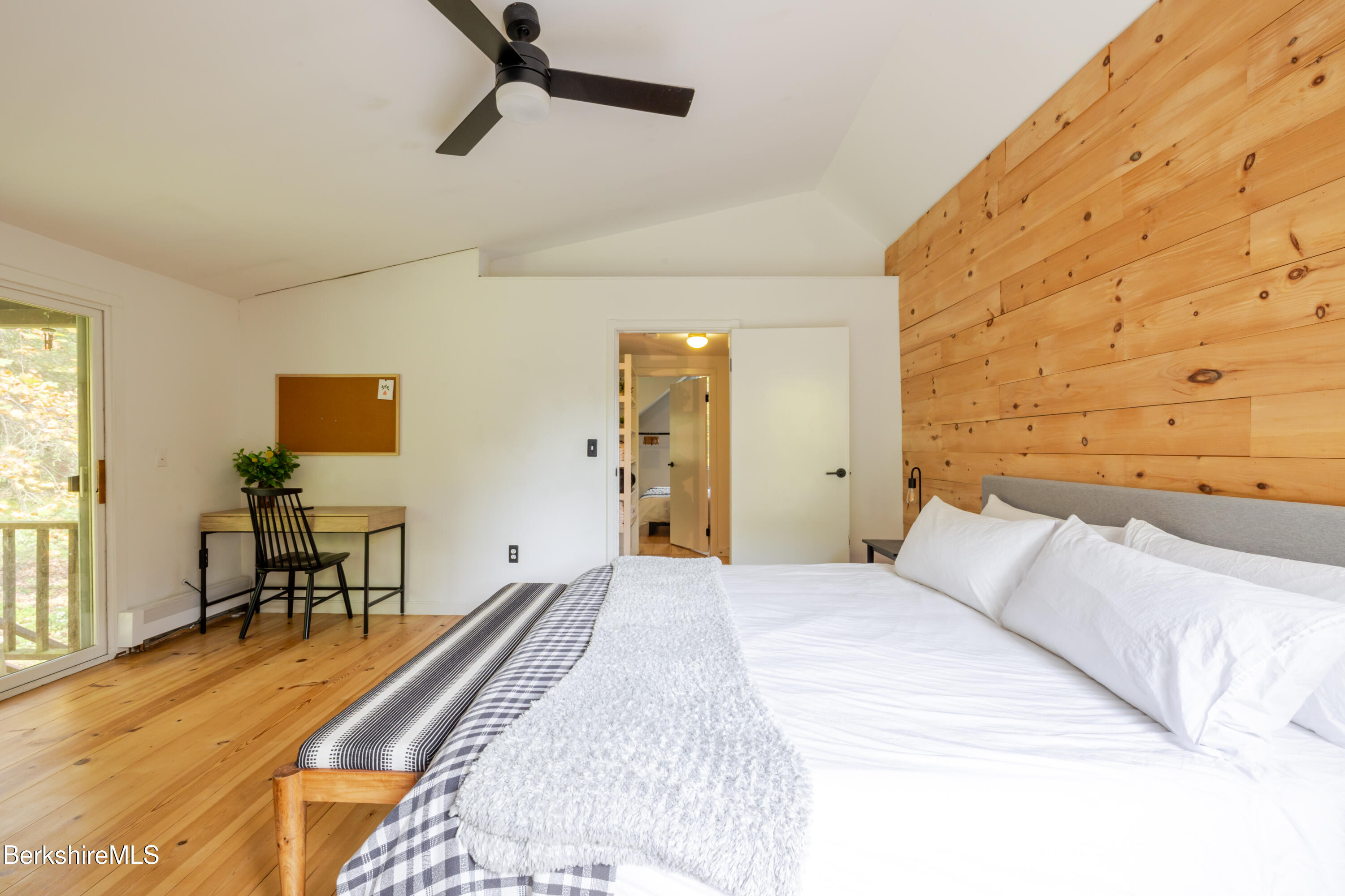 176 Division Street Great Barrington, MA 01230 - Photo 27 of 40 a bedroom with a bed and a table in it