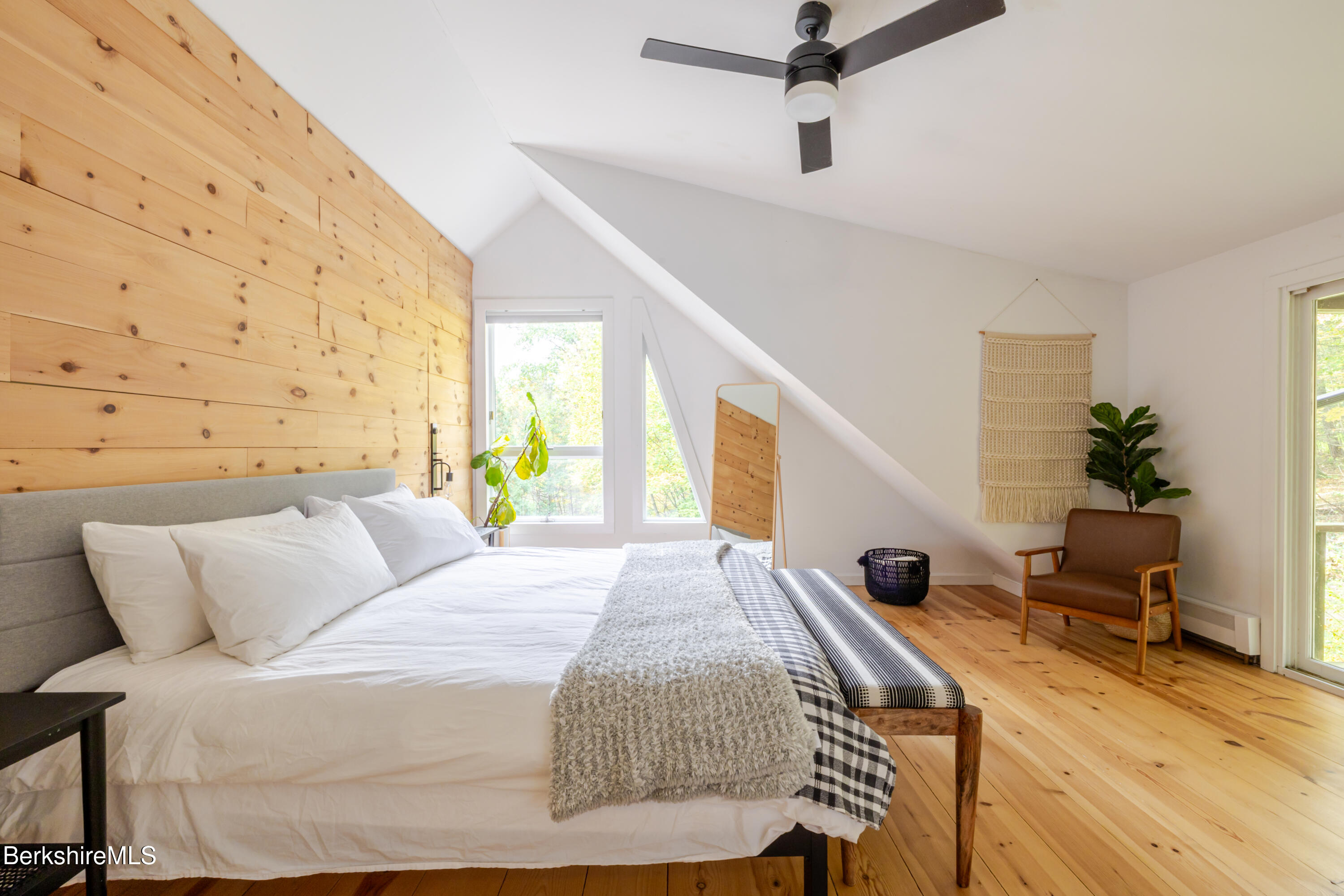 176 Division Street Great Barrington, MA 01230 - Photo 28 of 40 a bedroom with a bed and wooden floor