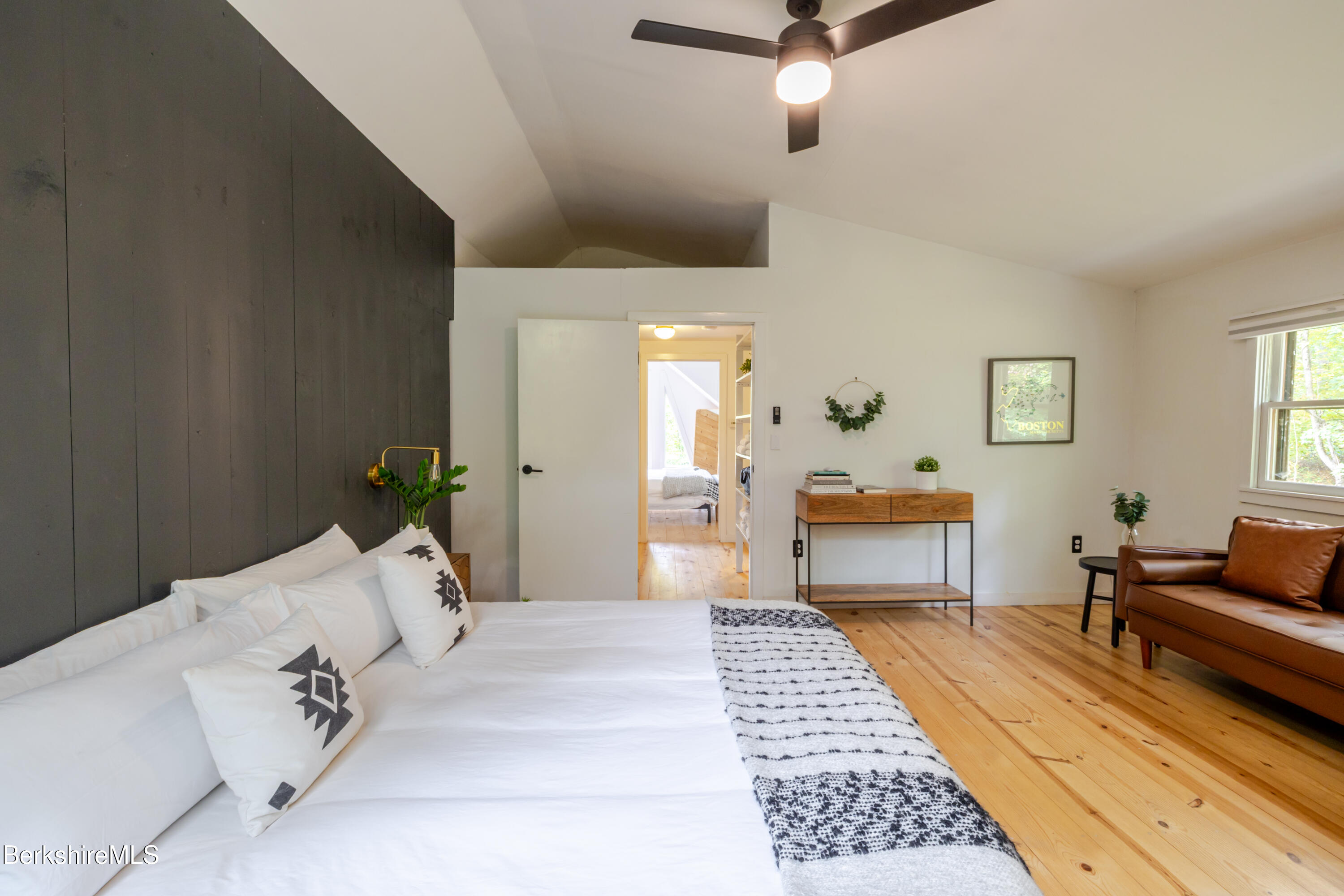 176 Division Street Great Barrington, MA 01230 - Photo 32 of 40 a bedroom with a bed and a couch