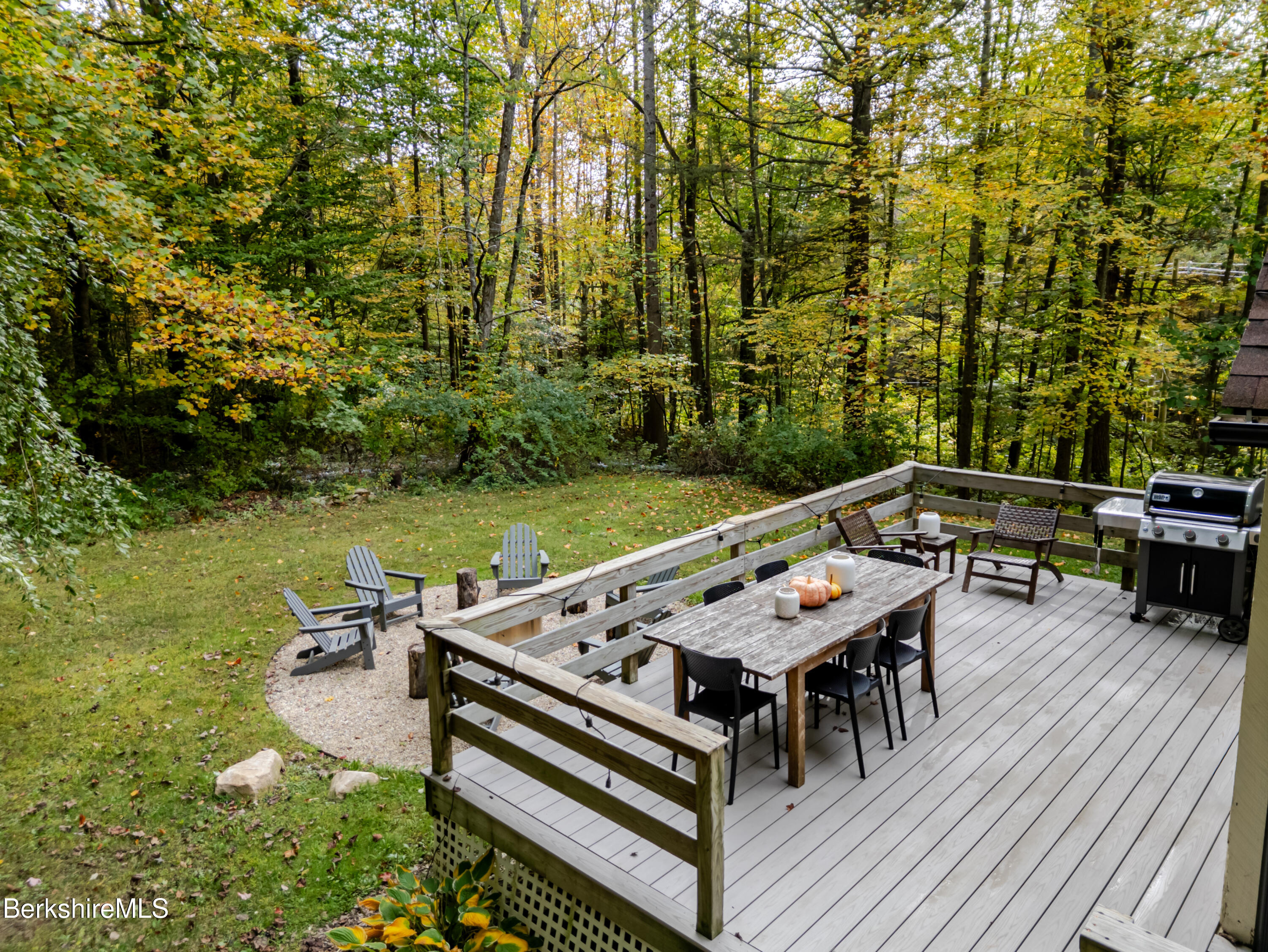 176 Division Street Great Barrington, MA 01230 - Photo 35 of 40 a view of a chairs and table on the wooden deck