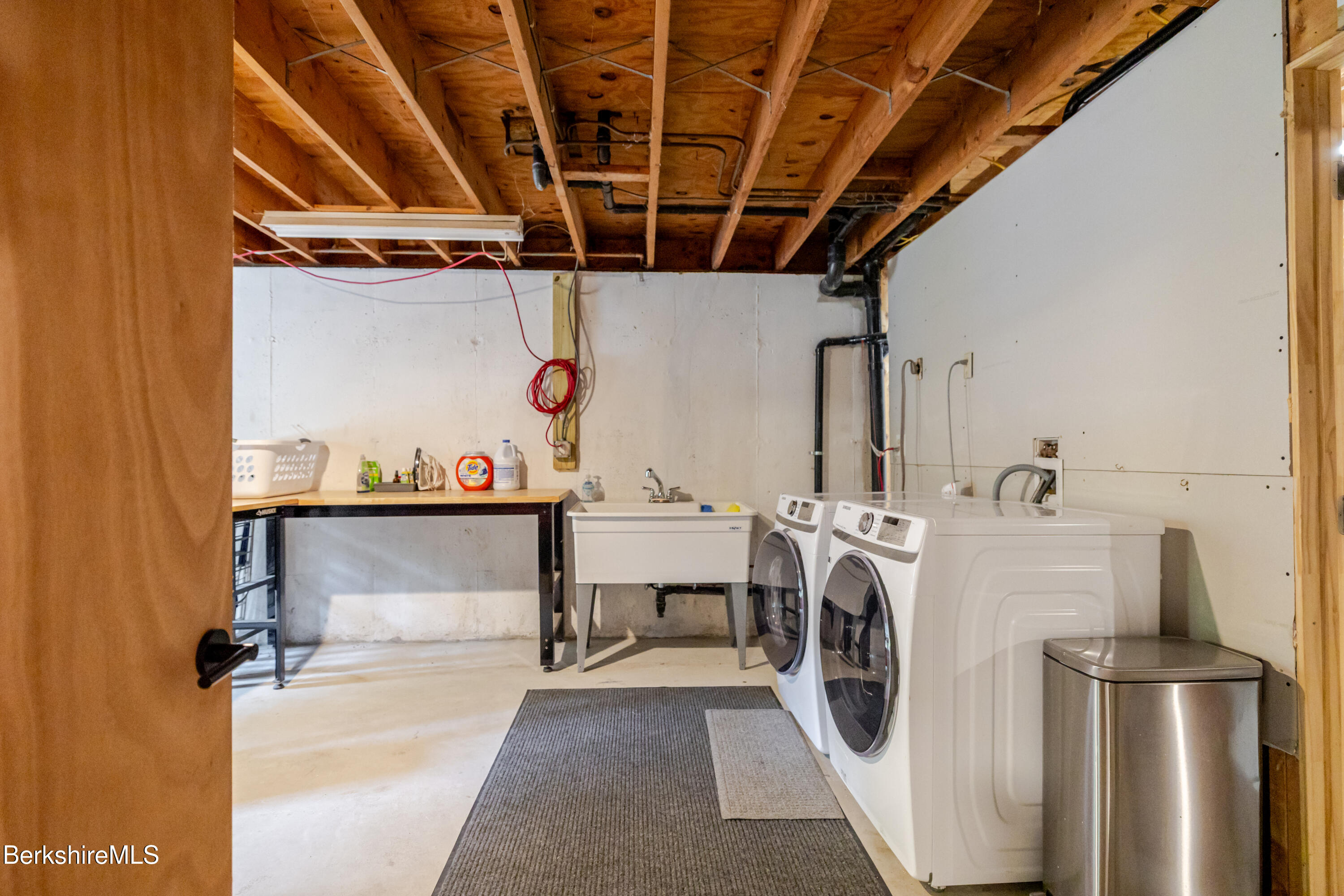 176 Division Street Great Barrington, MA 01230 - Photo 40 of 40 a view of a storage & utility room with washer and dryer