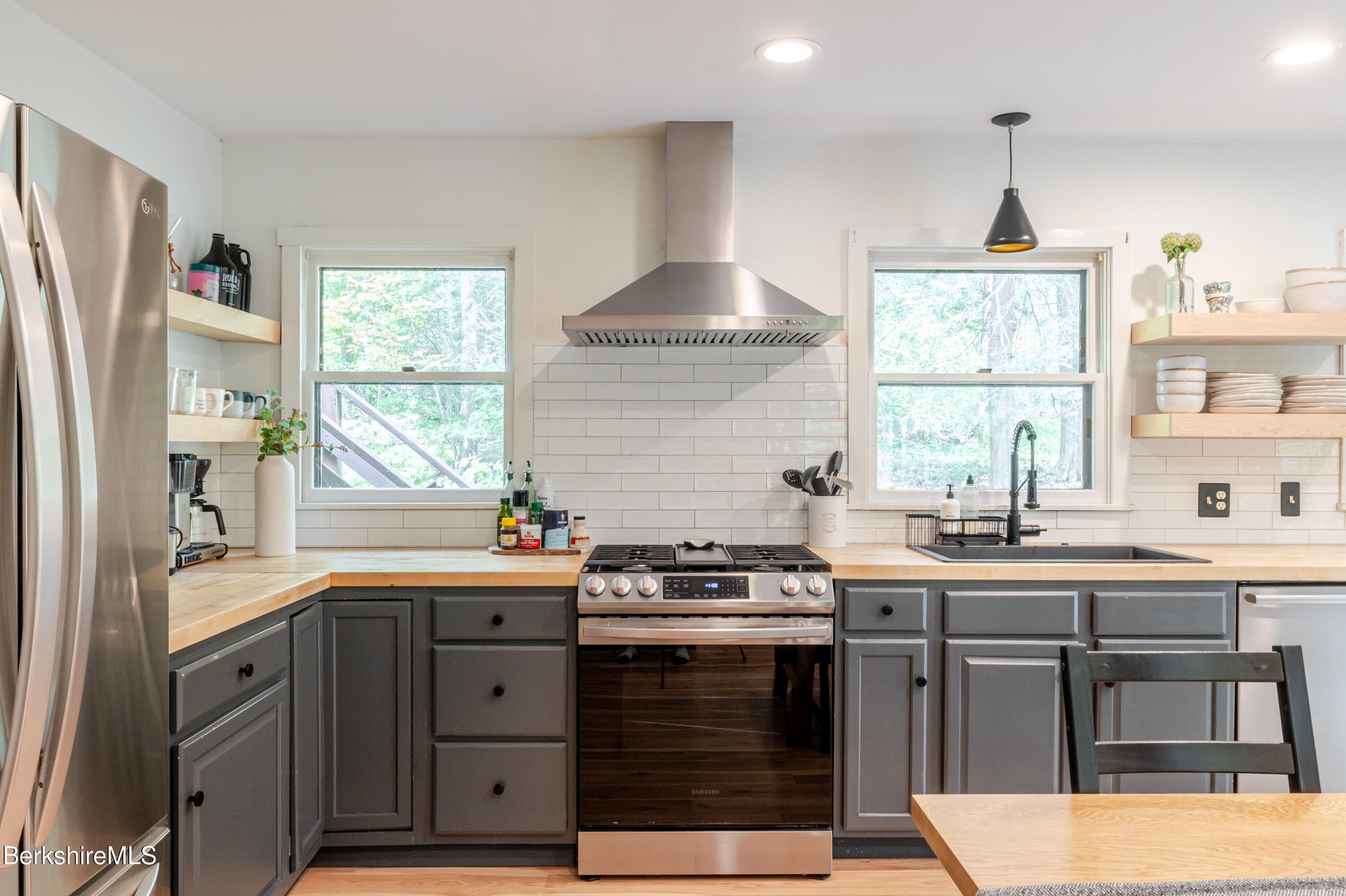 176 Division Street Great Barrington, MA 01230 - Photo 7 of 40 a kitchen with stainless steel appliances a sink stove and window