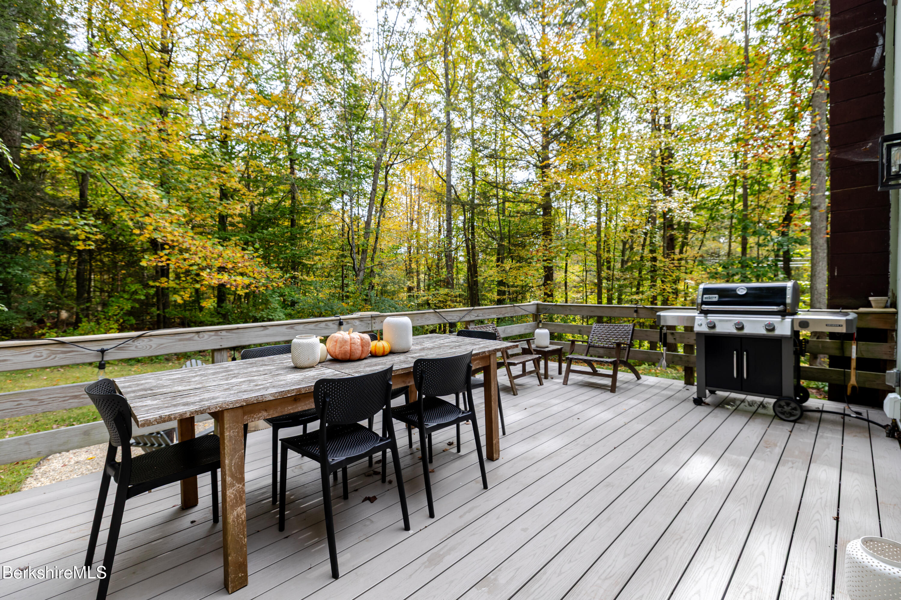 176 Division Street Great Barrington, MA 01230 - Photo 10 of 40 a view of a dinning tables and chairs in deck