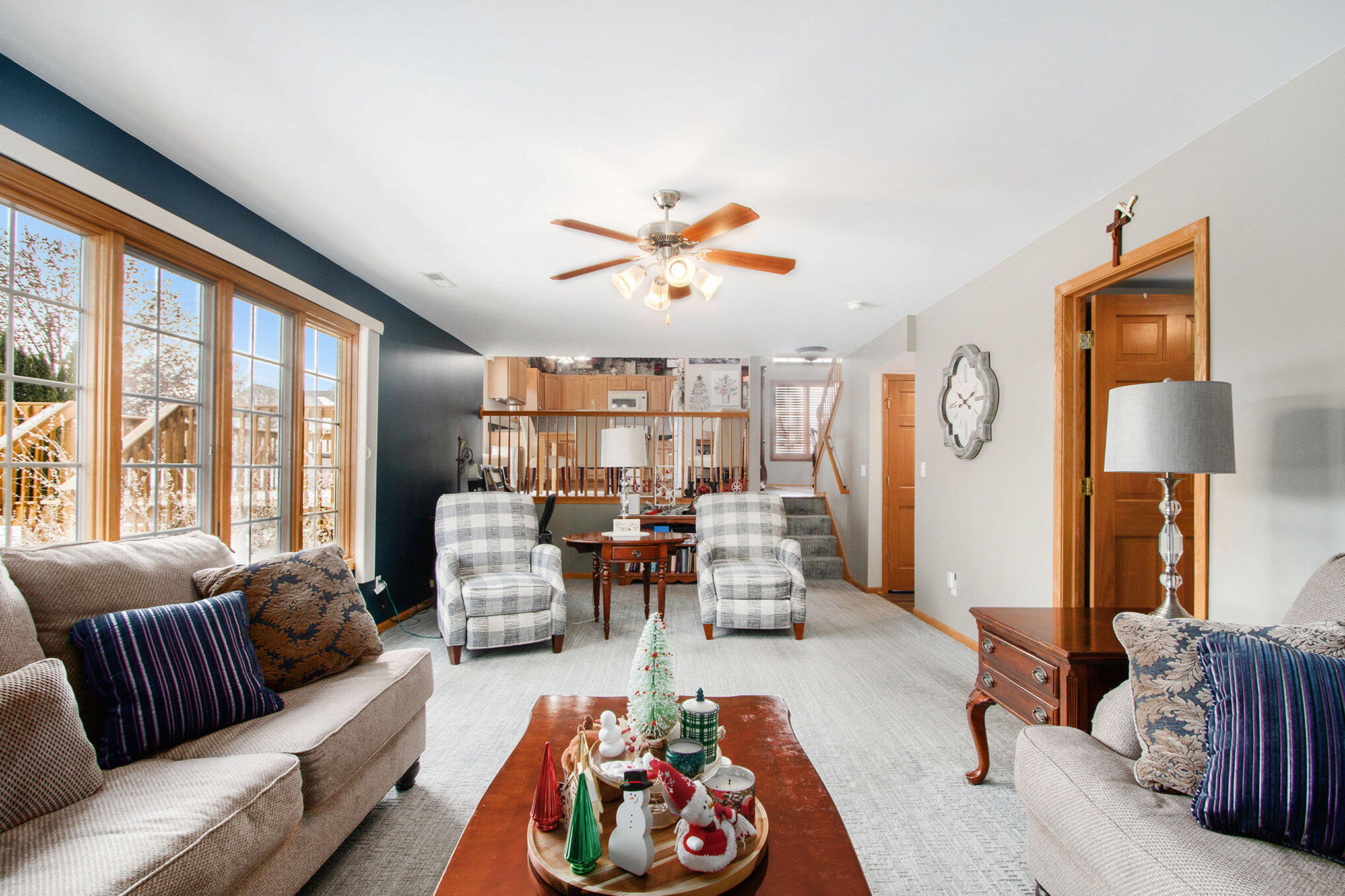 10399 Pike Street Crown Point, IN 46307 - Photo 11 of 25 a living room with furniture fireplace and a large window
