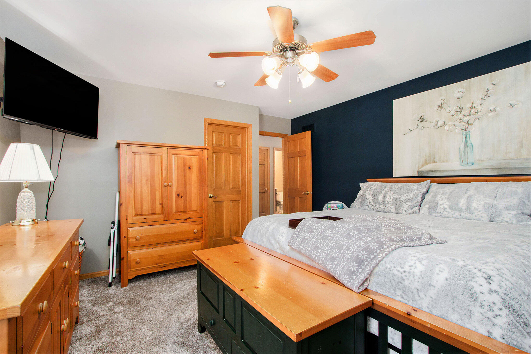 10399 Pike Street Crown Point, IN 46307 - Photo 15 of 25 a bedroom with a bed and a flat screen tv