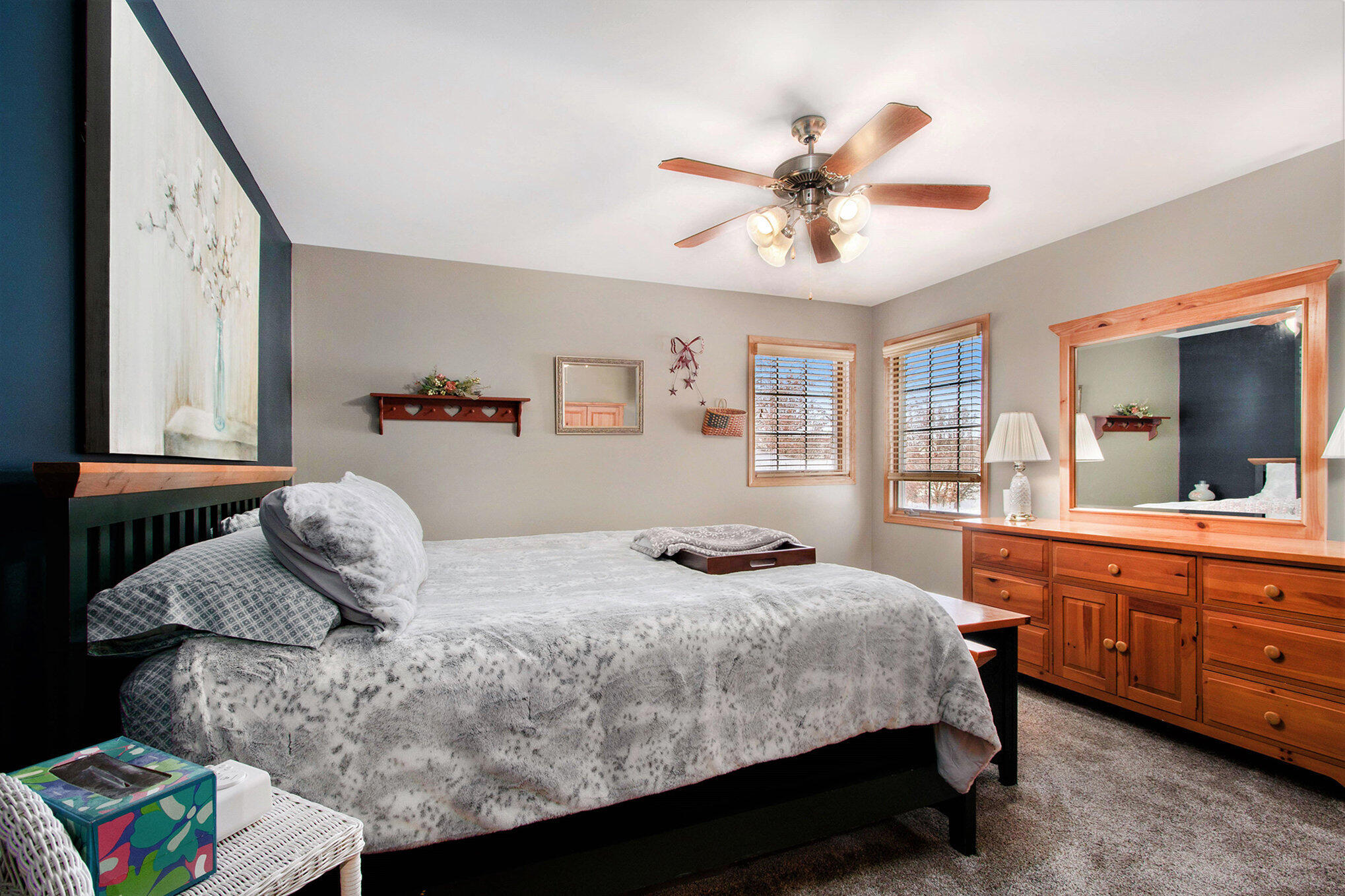 10399 Pike Street Crown Point, IN 46307 - Photo 16 of 25 a bedroom with a bed and a chandelier