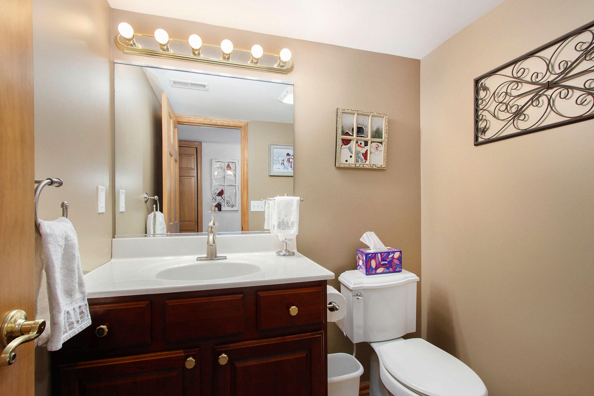10399 Pike Street Crown Point, IN 46307 - Photo 19 of 25 a bathroom with a sink mirror and toilet