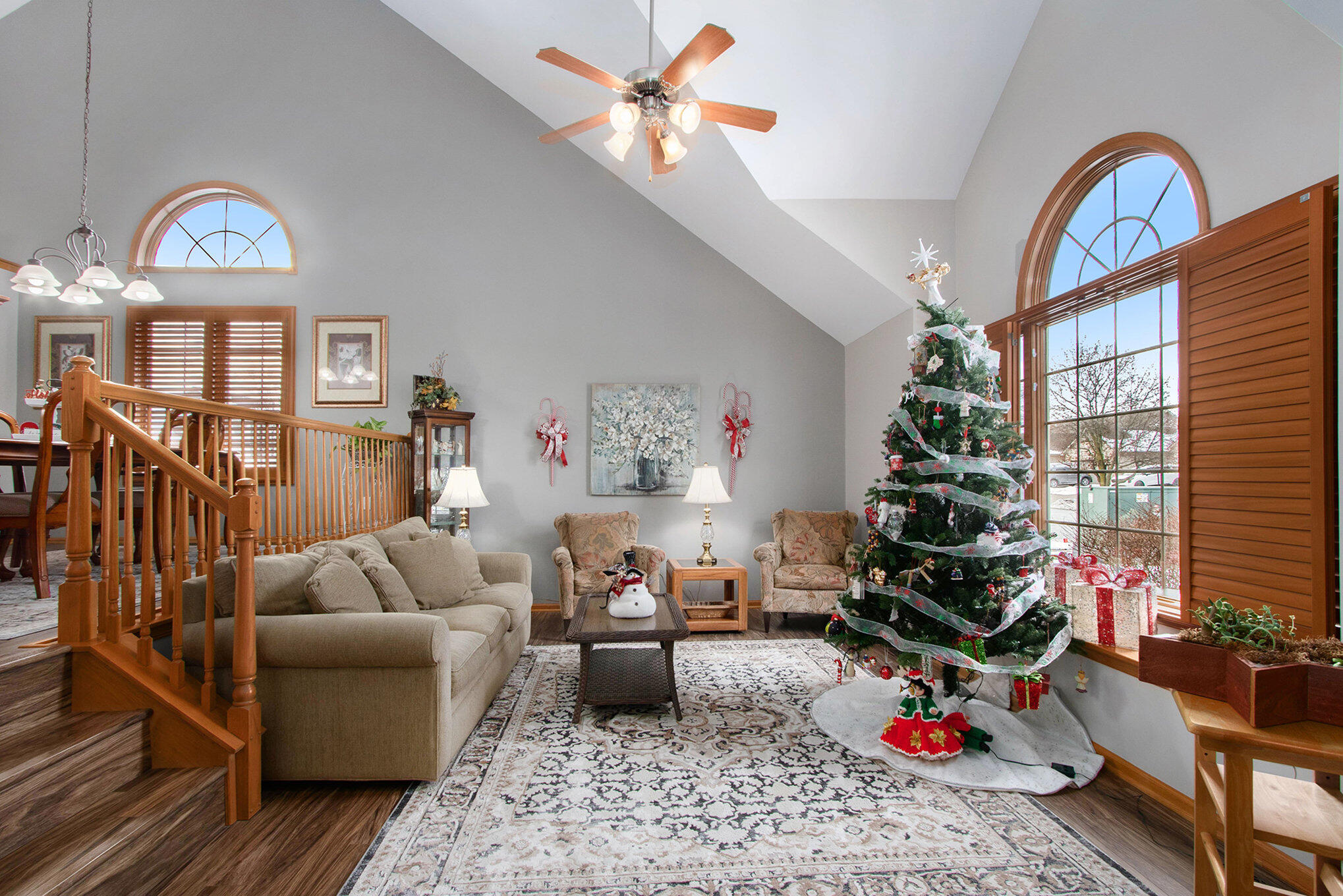 10399 Pike Street Crown Point, IN 46307 - Photo 2 of 25 a living room with furniture a rug and a chandelier