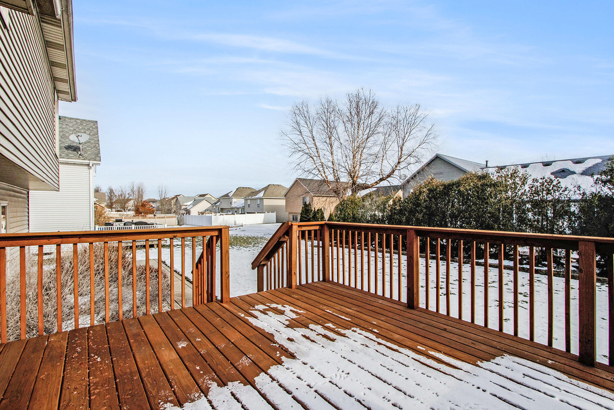 10399 Pike Street Crown Point, IN 46307 - Photo 21 of 25 a view of balcony with wooden floor and fence