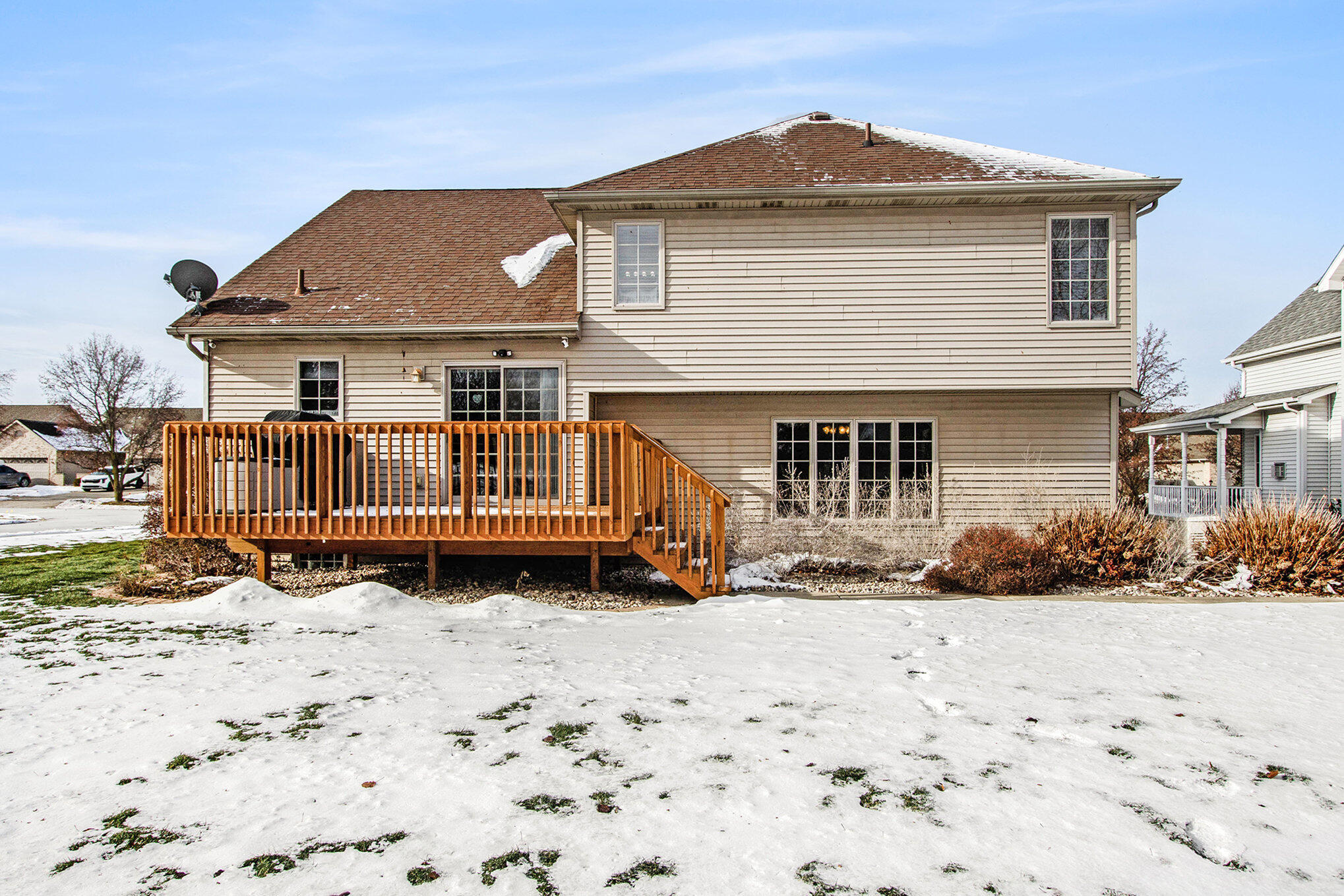 10399 Pike Street Crown Point, IN 46307 - Photo 22 of 25 a front view of a house with a yard covered in snow