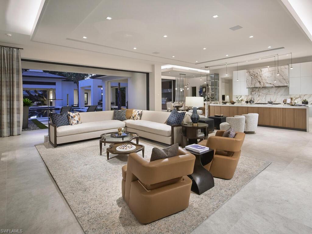 477 3rd Street North Naples, FL 34102 - Photo 6 of 33 a living room with furniture and a large window