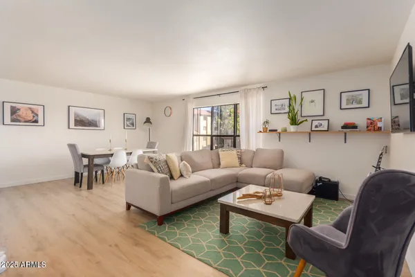 a living room with furniture and a table