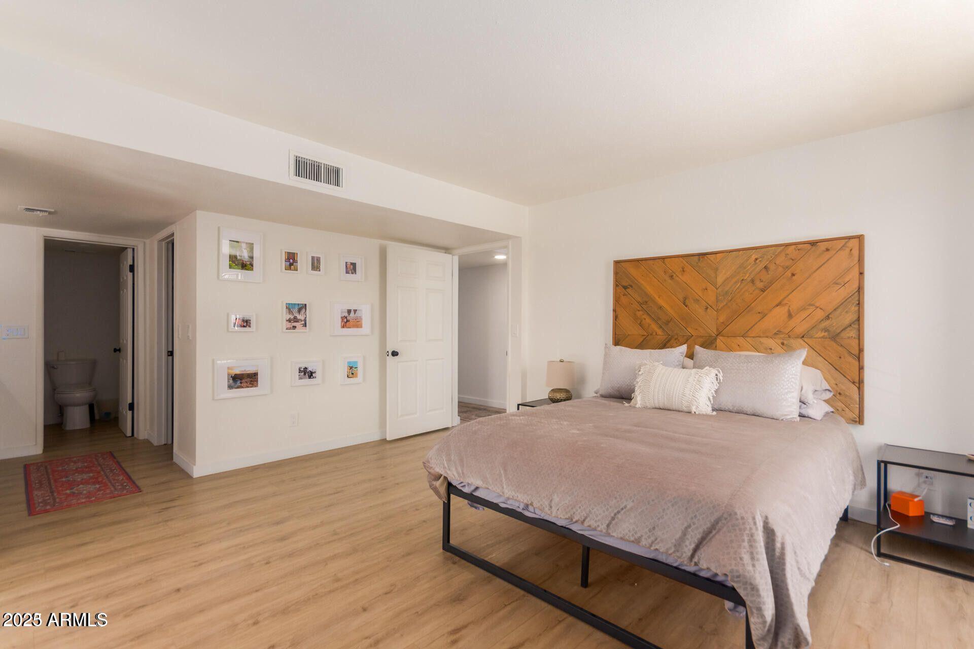 5122 North 31st Way, Unit 238 Phoenix, AZ 85016 - Photo 11 of 21 a bedroom with a large bed and a window