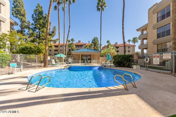 a view of a swimming pool with a lounge chairs
