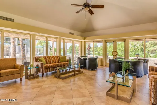 a living room with furniture and a large window