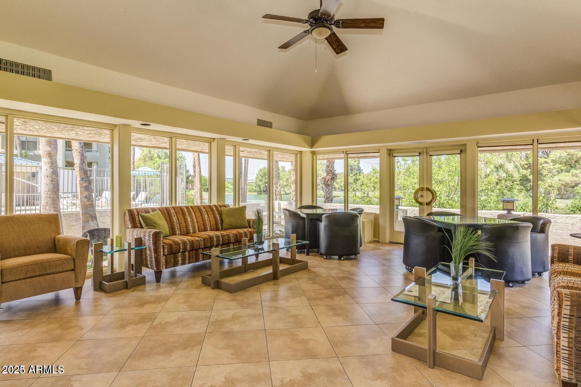 5122 North 31st Way, Unit 238 Phoenix, AZ 85016 - Photo 18 of 21 a living room with furniture and a large window