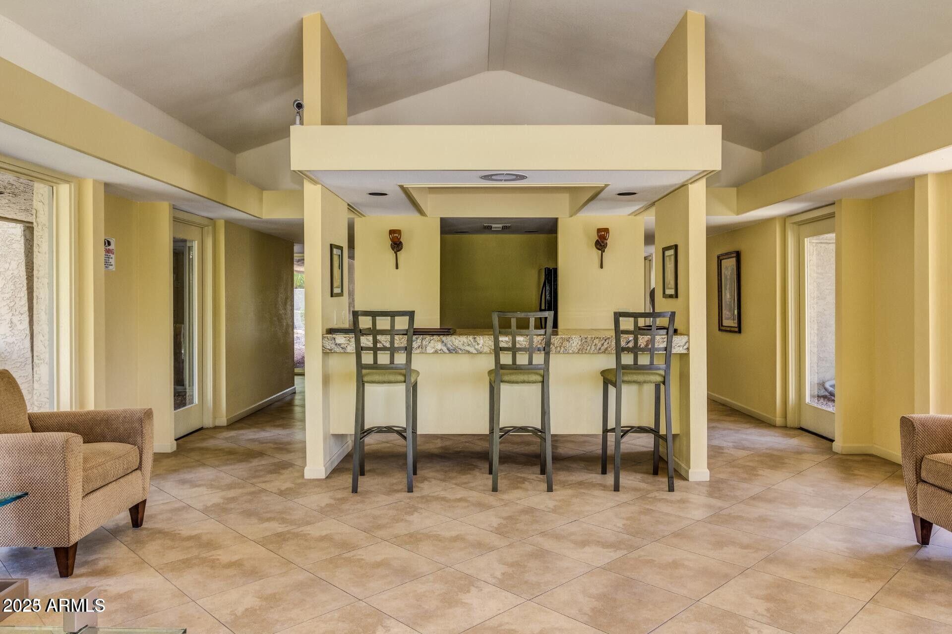5122 North 31st Way, Unit 238 Phoenix, AZ 85016 - Photo 19 of 21 a view of a livingroom with furniture and windows