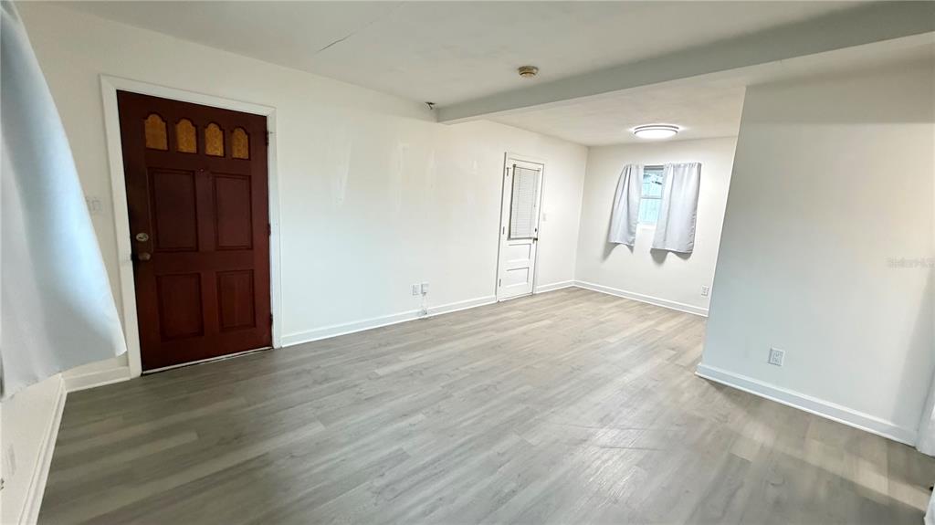 6310 Lake Underhill Road, Unit A Orlando, FL 32807 - Photo 2 of 12 wooden floor in an empty room