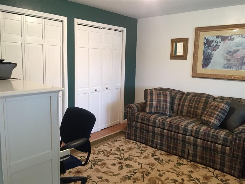 321 Rocktown Road Tarrs, PA 15688 - Photo 18 of 25 CURRENTLY BEING USED AS A DEN BUT COULD BE A DINING ROOM OR FIRST FLOOR BEDROOM WITH ALL THOSE CLOSETS!