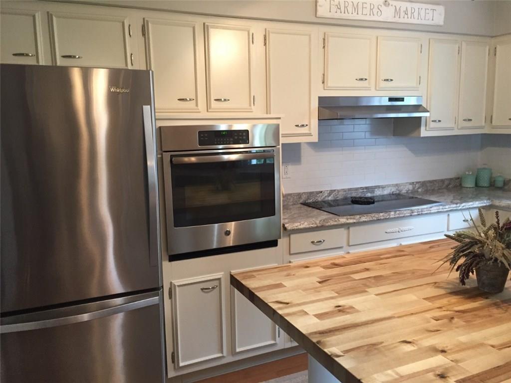 321 Rocktown Road Tarrs, PA 15688 - Photo 9 of 25 BEAUTIFUL KITCHEN WITH STAINLESS STEEL APPLIANCES AND BUTCHER BLOCK ISLAND! SO MUCH STORAGE!