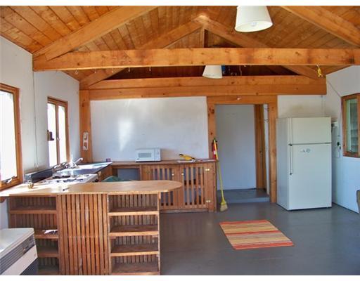 6 Boyden Farm Road Vinalhaven, ME 04863 - Photo 3 of 9 Kitchen. Kitchen with shelves...