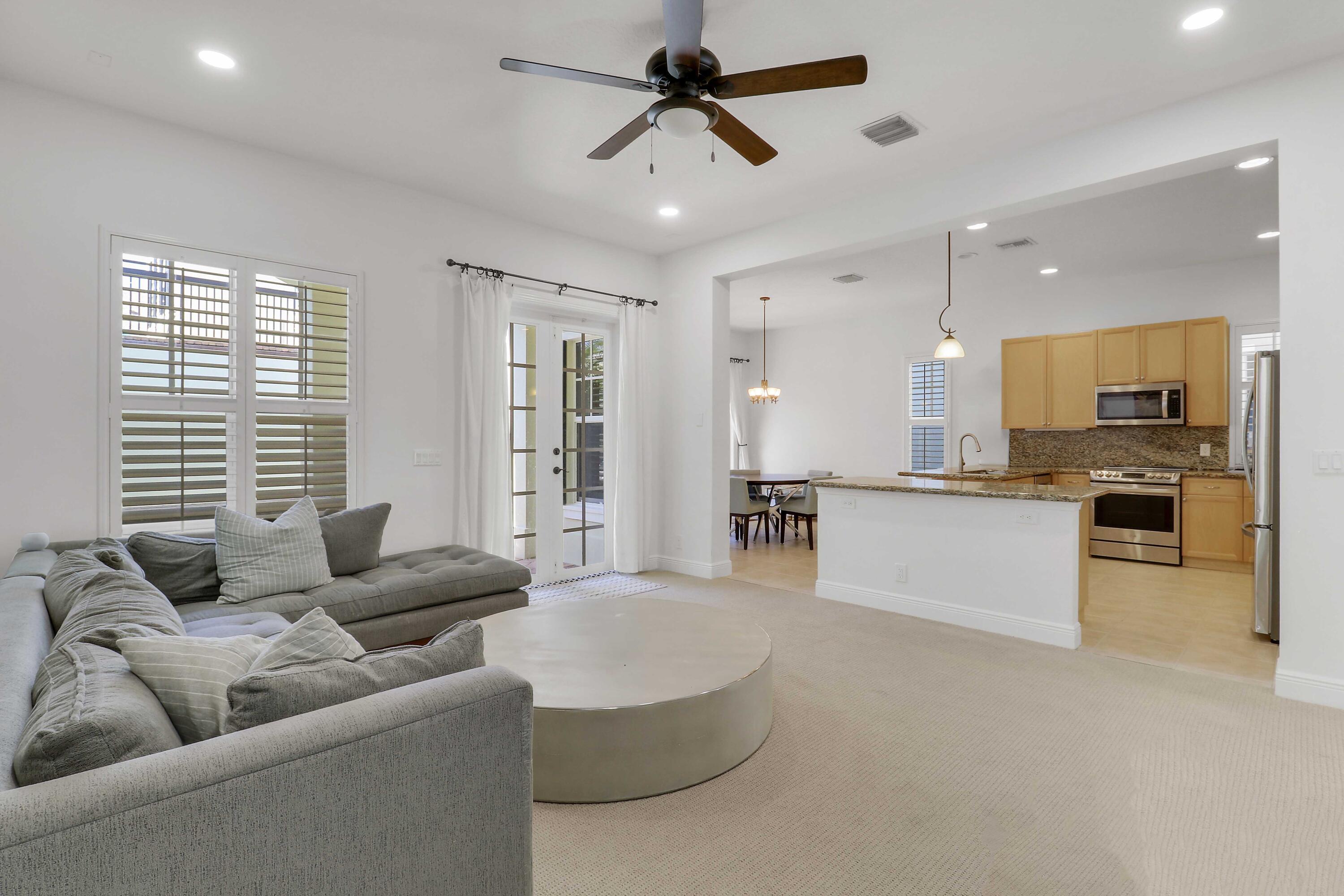 108 Spikerush Road Jupiter, FL 33458 - Photo 5 of 37 Kitchen and Living Room