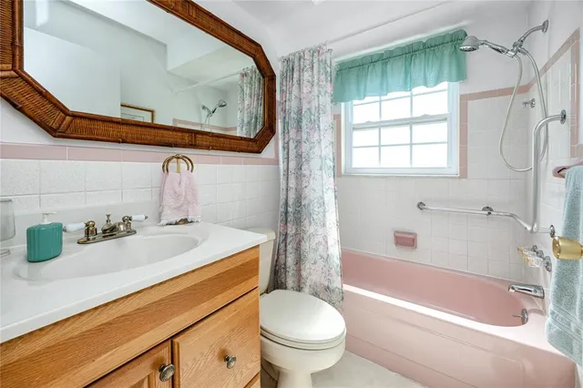 a bathroom with a sink a toilet and a bathtub