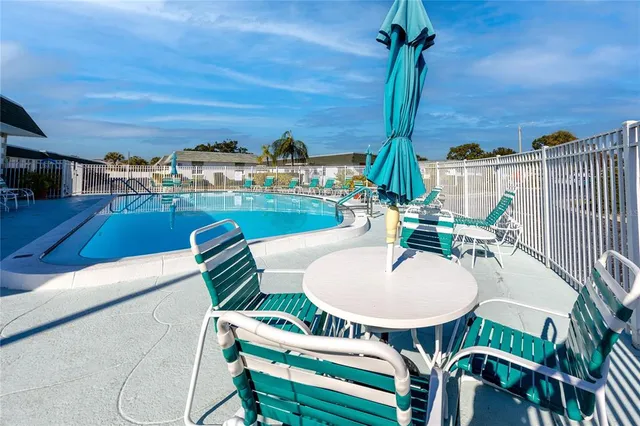 a view of a patio with swimming pool