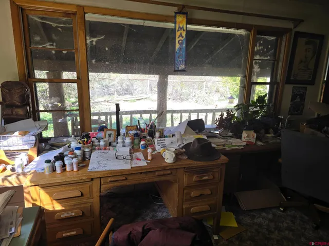 a view of a chairs and table in patio