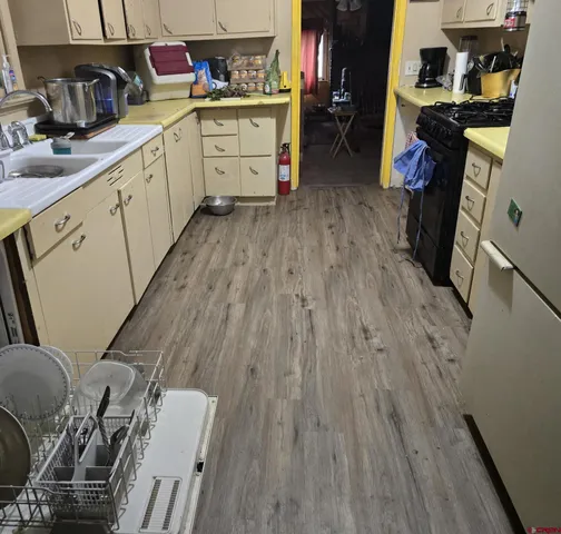 a bedroom with furniture and a book shelf