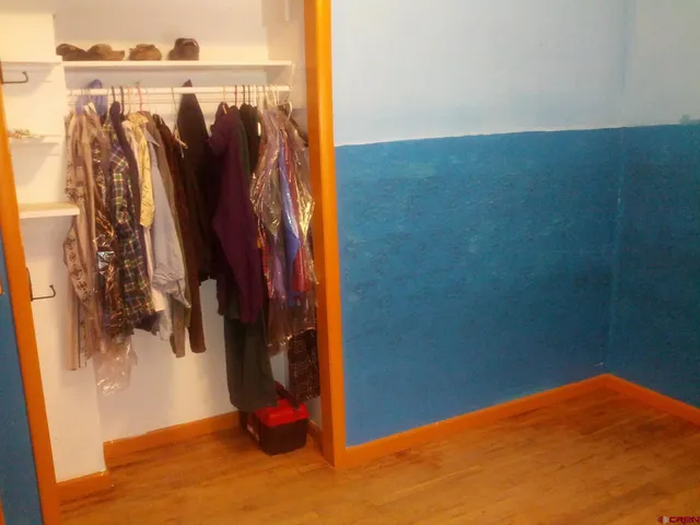 a kitchen with a stove and a refrigerator