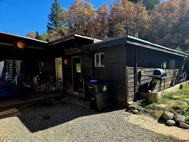 a living room with furniture and a ceiling fan
