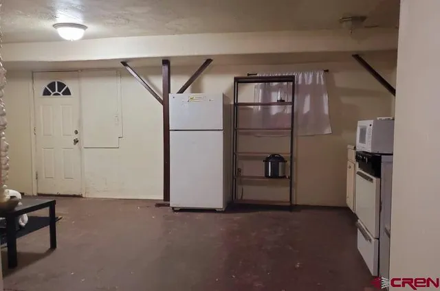 a utility room with sink dryer and washer