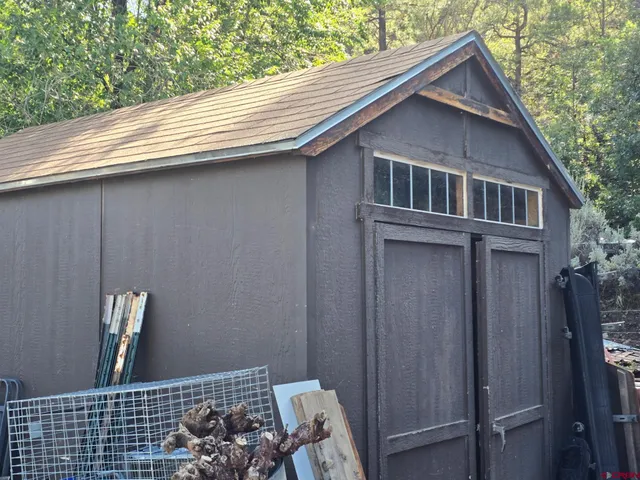a living room with furniture and a ceiling fan
